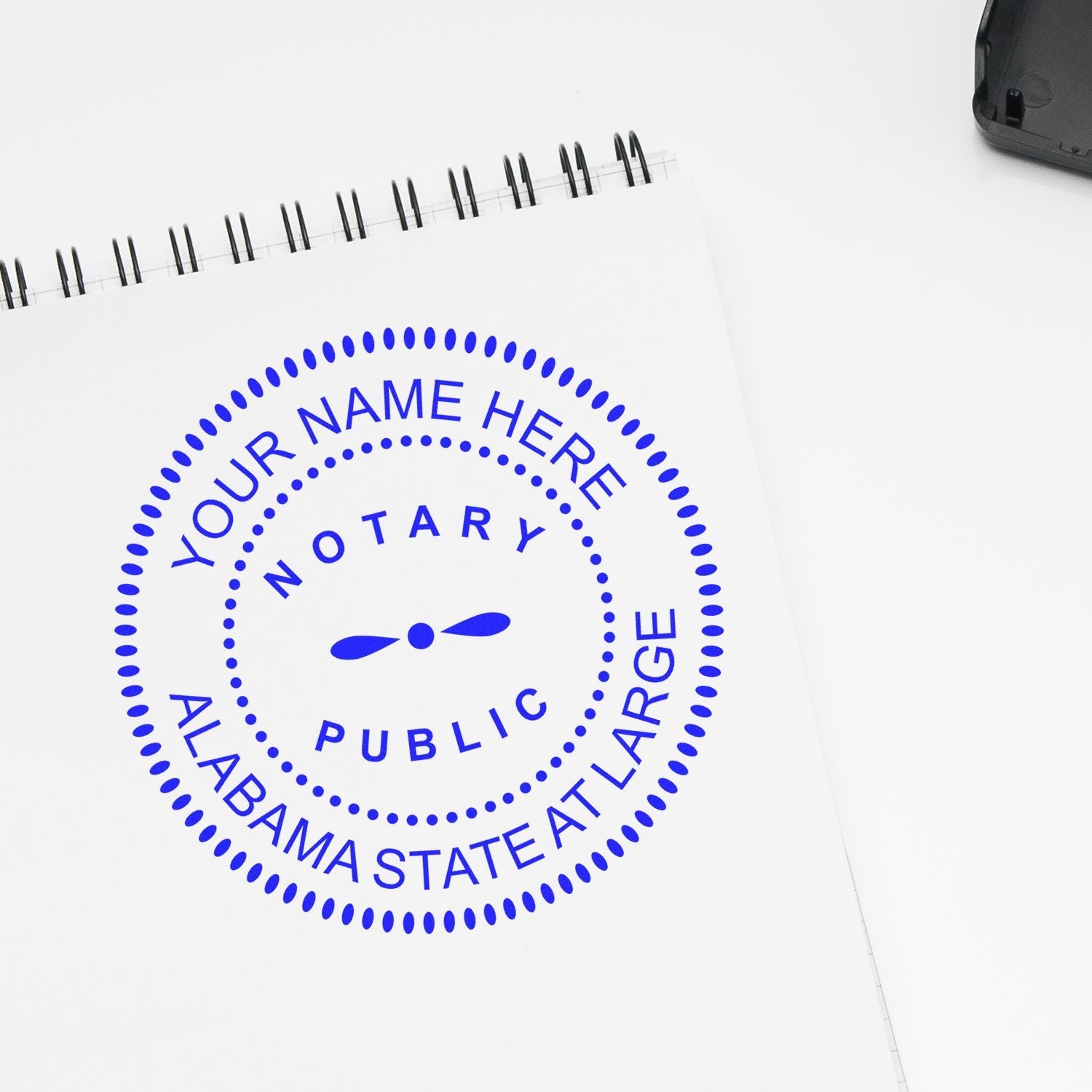 Image of a notary public stamp on a notepad. Blog post: Stay Protected: Understanding the Notary Bond in Alabama Feature Image.