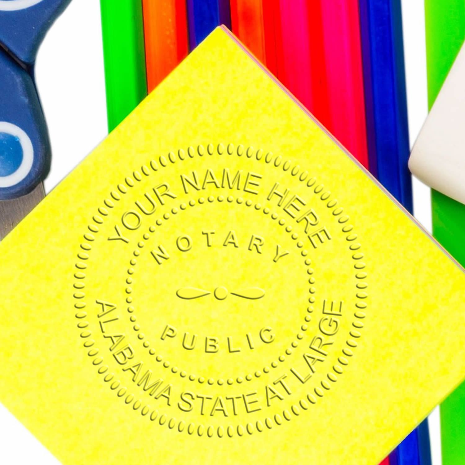 Image of a notary stamp impression on yellow paper with colorful pens and scissors in the background. Blog post: The Ultimate Guide to Notary Stamp Self-Inking: Choose Wisely Feature Image.