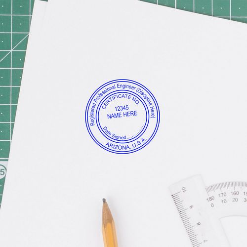 Embossed Arizona Engineer Seal on white paper with pencil and ruler. Blog post: Arizona Engineer Seal Embossed.