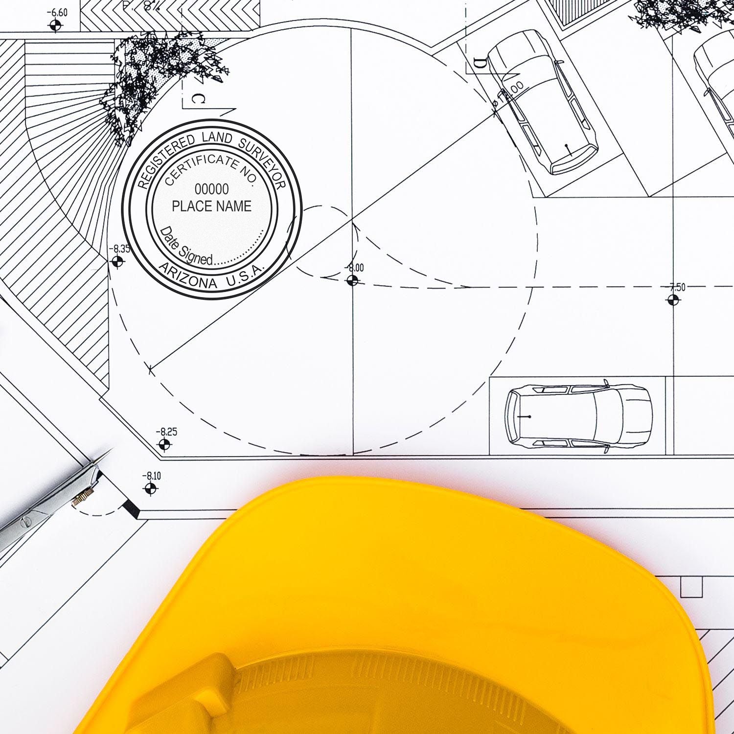 Blueprint with Arizona Land Surveyor Seal, yellow hard hat, and pen. Blog post: Arizona Land Surveyor Seal.