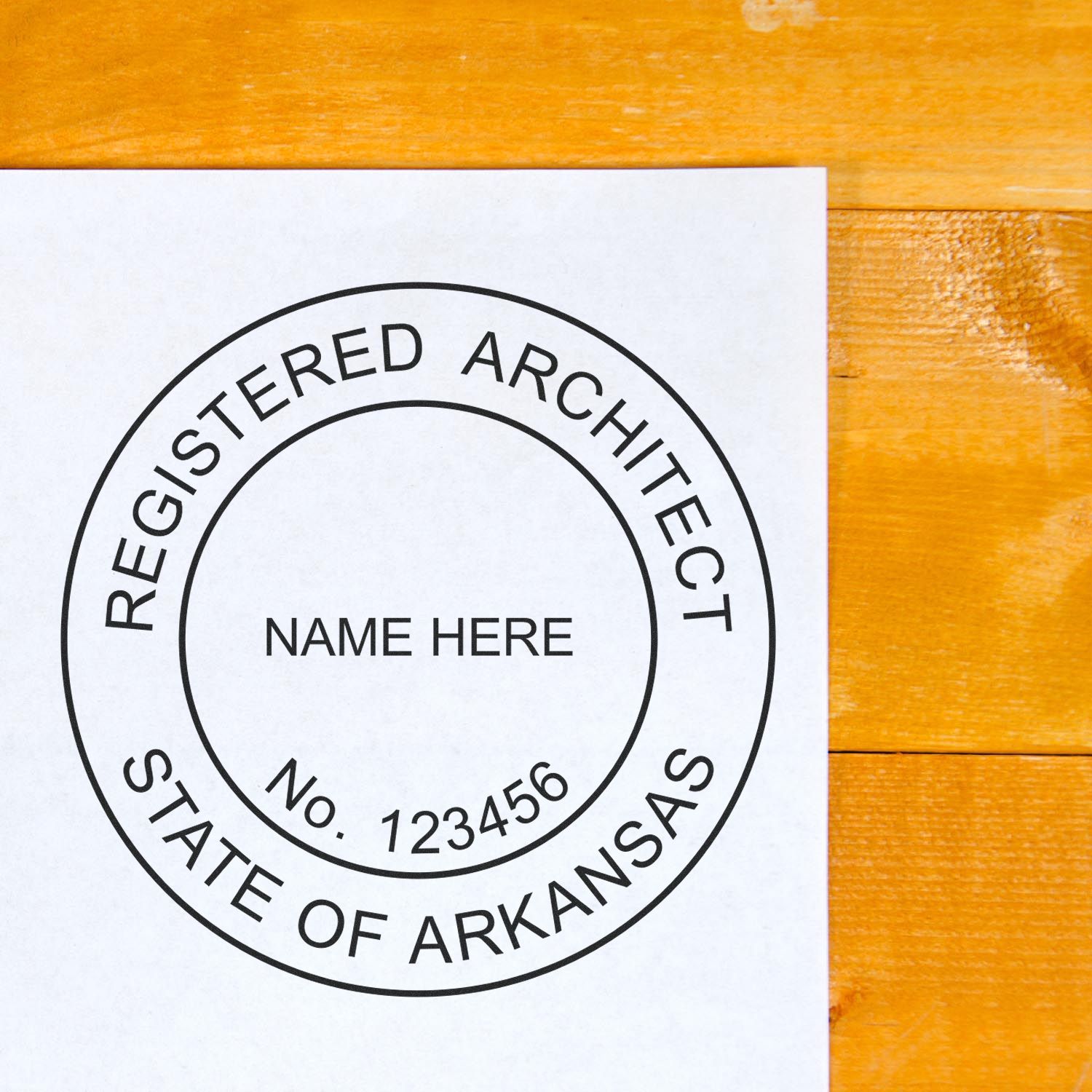 Unlock the Power of Professionalism: Arkansas Architect Seals feature image. A registered architect seal from the State of Arkansas on a wooden surface.