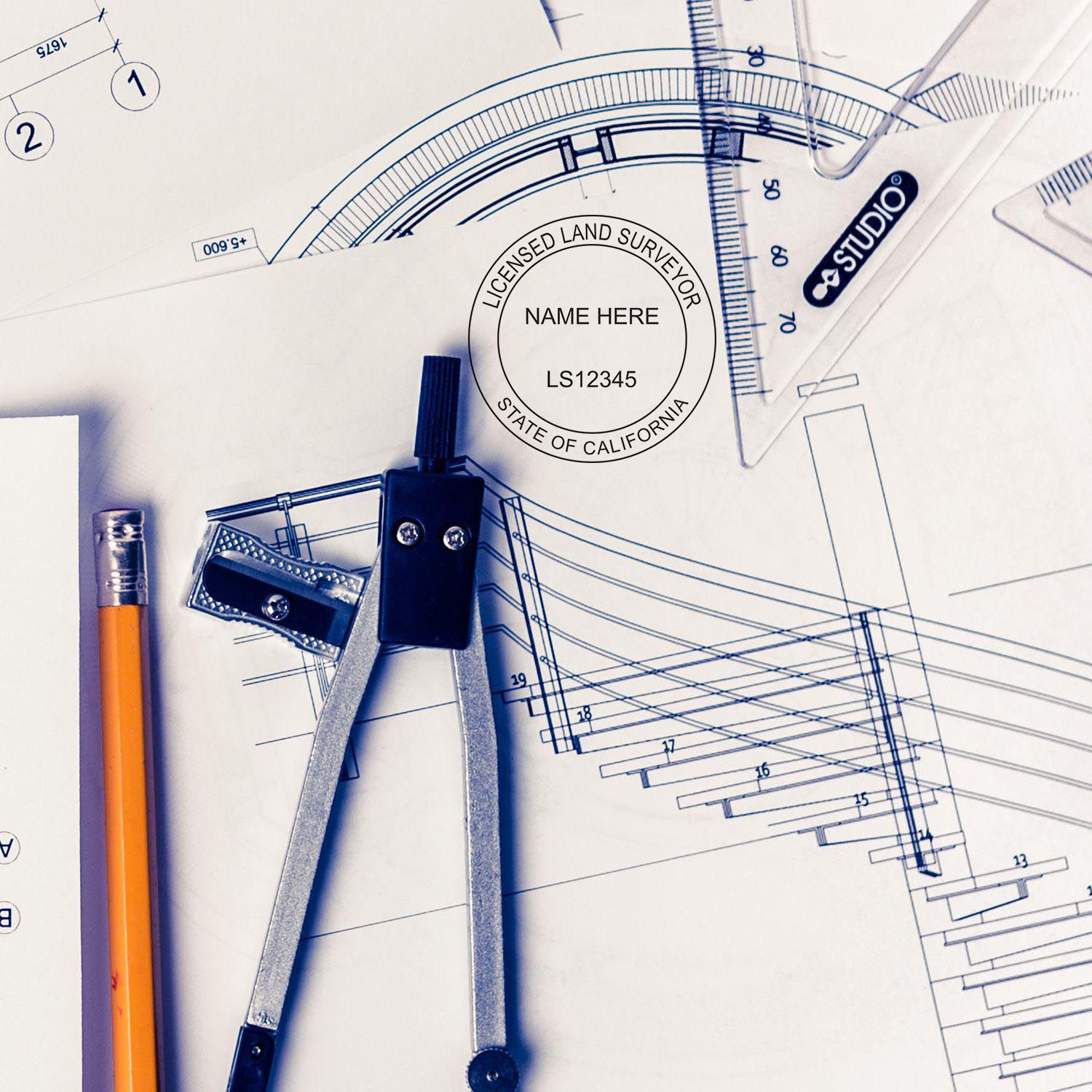 California Land Surveyor Seal blog post: A surveyor's seal, compass, pencil, and architectural plans on a desk.