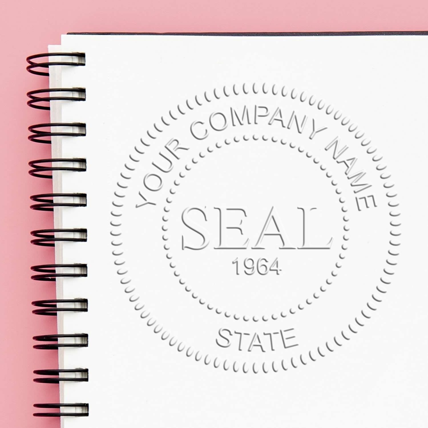 Empower Efficiency: The Benefits of Corporate Rubber Stamps Feature Image - A notebook with a corporate seal imprint on a pink background.