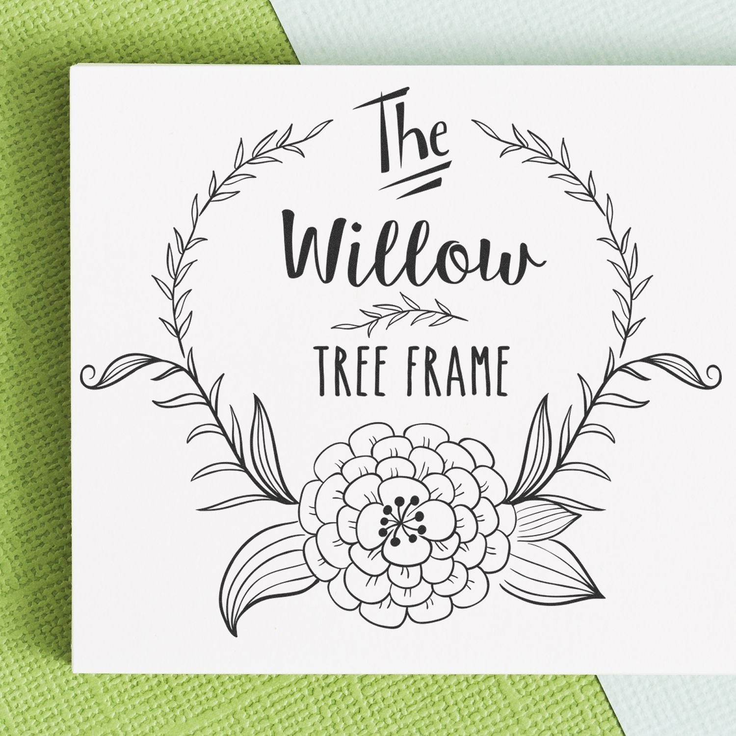 Custom Rubber Stamps Blog Post Image: A white card with 'The Willow Tree Frame' design, featuring floral and leafy elements.