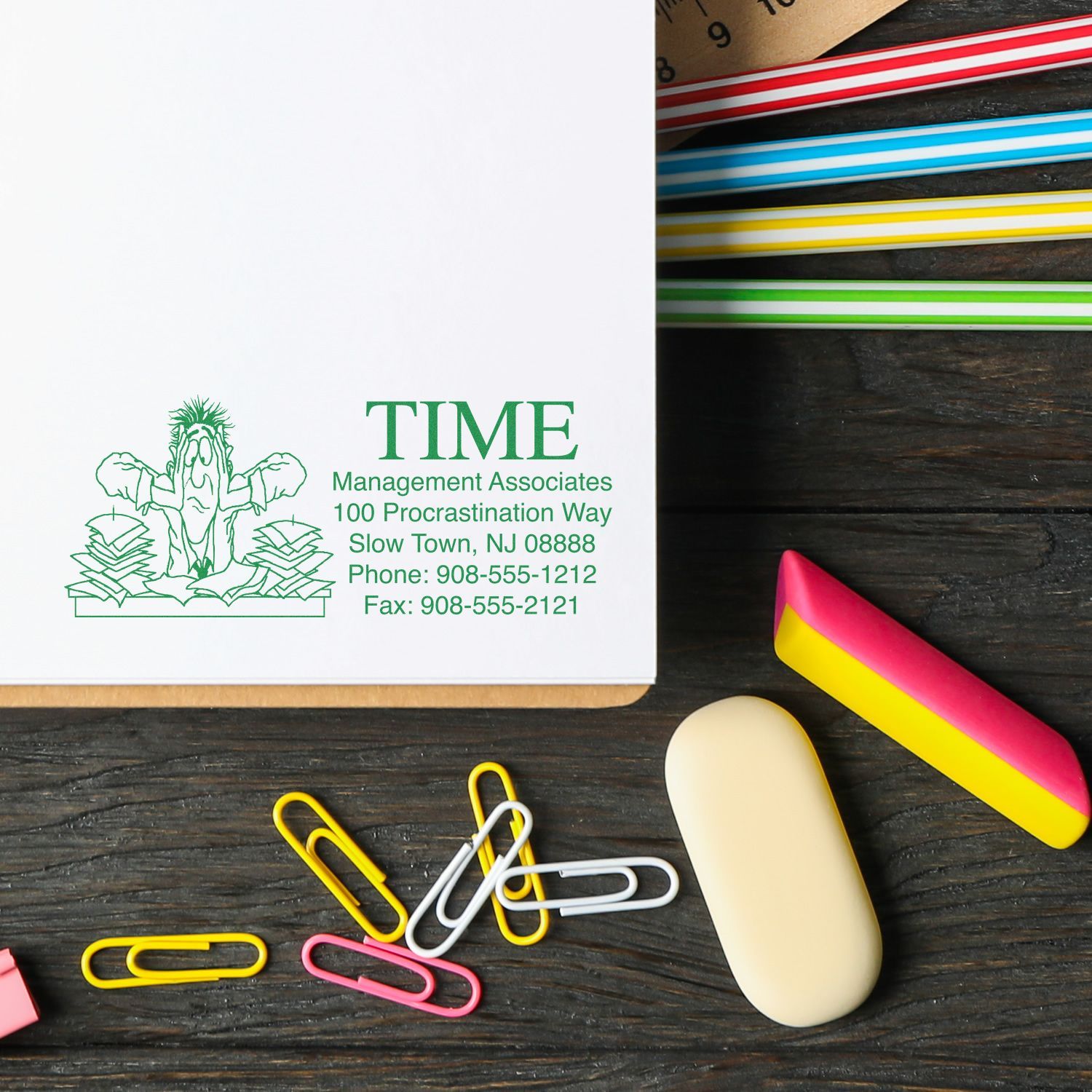 Personalized stamp on paper with colorful paperclips, eraser, and ruler. Get Creative with Personalized Stamps Blog Post Feature Image.