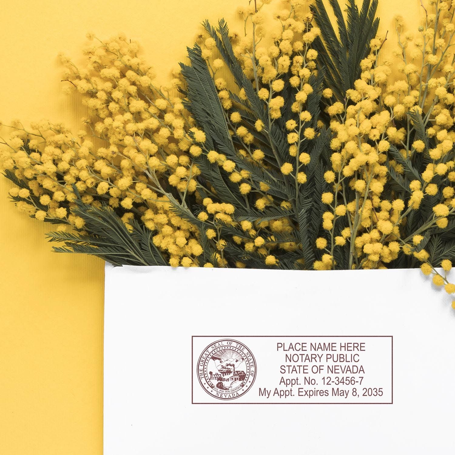 Yellow flowers and a Nevada notary stamp on a white envelope. Nevada Notary Supplies Blog Post Feature Image.