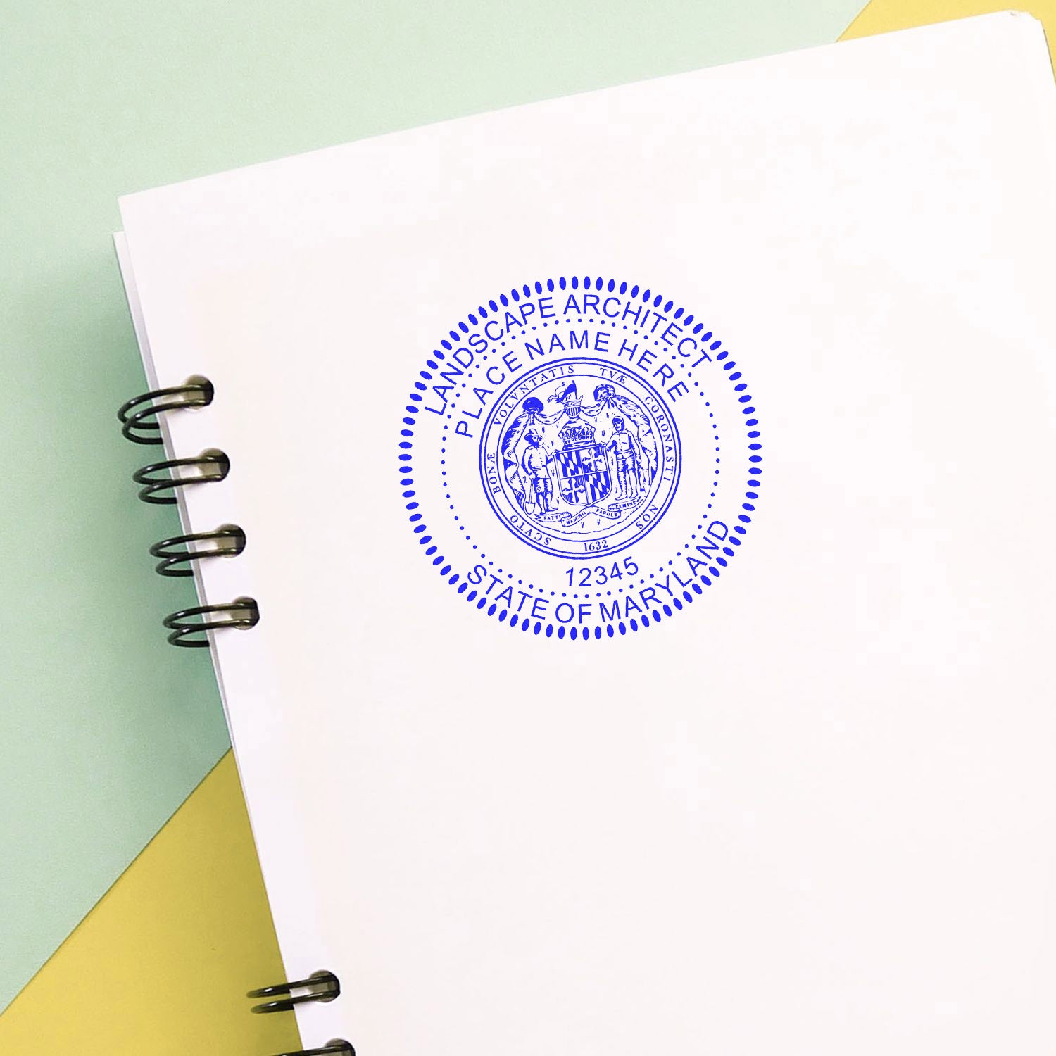 Maryland Landscape Architect Feature Image: A blue seal stamp on a white notebook with the text 'Landscape Architect State of Maryland'.