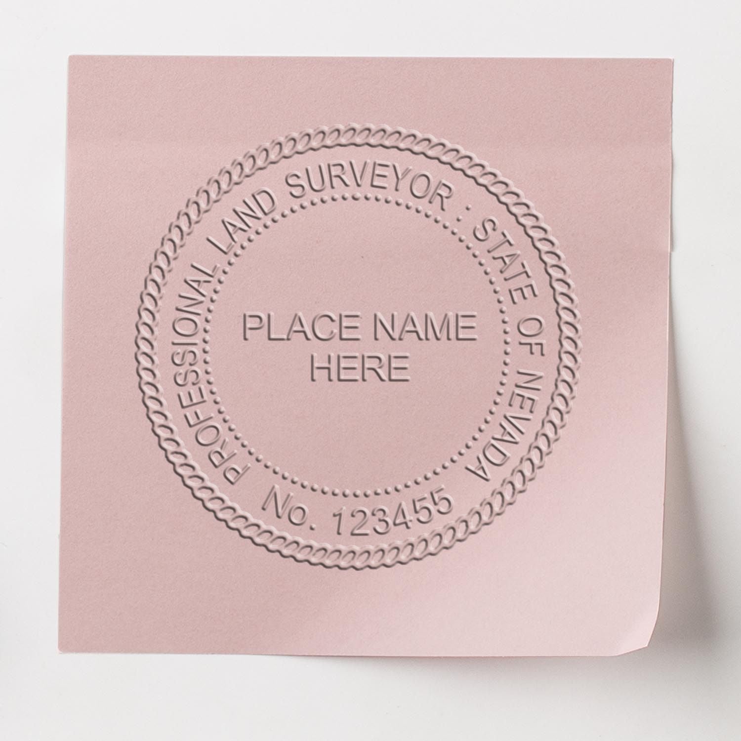 Image of a Nevada Land Surveyor Seal embossed on pink paper, featured in the blog post Nevada Land Surveyor Seal.