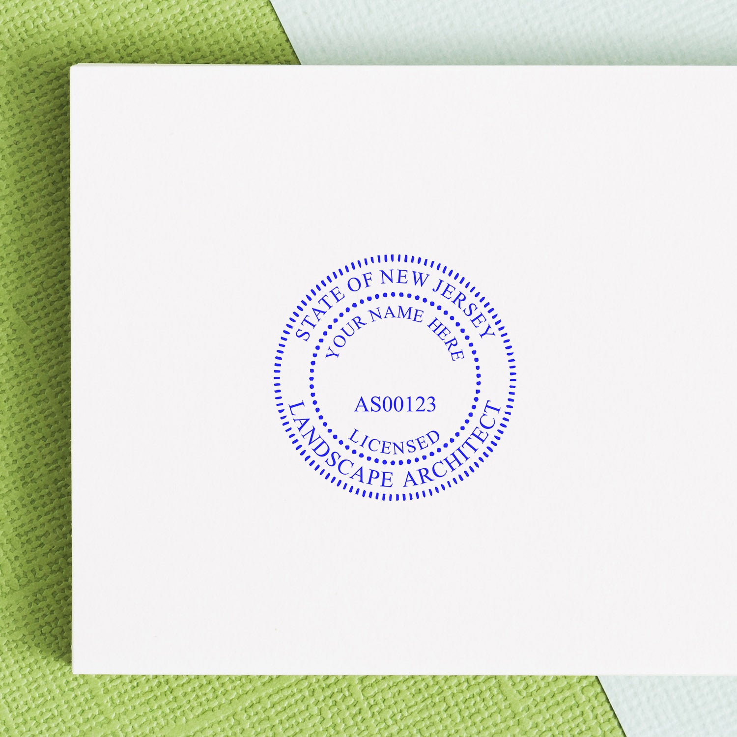 New Jersey Landscape Architect Feature Image: A white paper with a blue seal stamp for a licensed landscape architect in New Jersey.