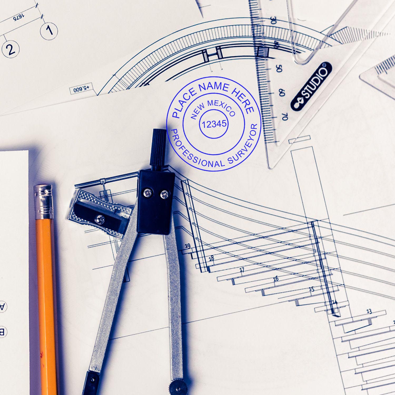 Blueprints with a New Mexico Land Surveyor Stamps seal, a pencil, and drafting tools. Blog post: New Mexico Land Surveyor Stamps.