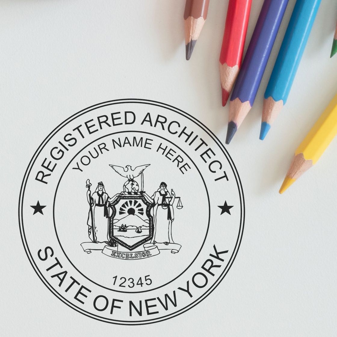 Image of a New York architect stamp with colored pencils. Blog post: Building Legally: How New York Architect Stamps Can Help You.