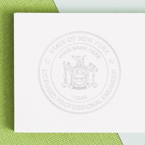 Image of a New York Engineer embossing seal on a white document, featuring the State of New York emblem and text Licensed Professional Engineer.