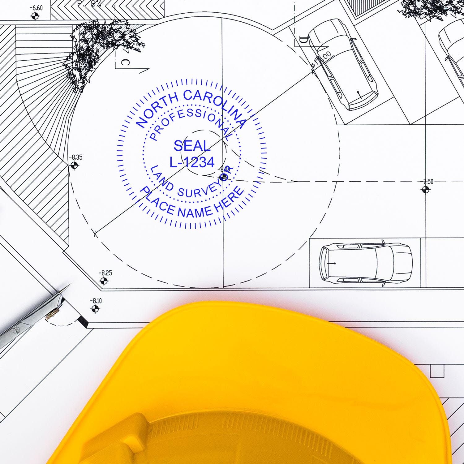 North Carolina Land Surveyor Stamp on a blueprint with a yellow hard hat and pen nearby, featured in the blog post: North Carolina Land Surveyor Stamp.