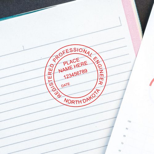 North Dakota Seal: Red registered professional engineer stamp on a lined notebook page, featured in the blog post 'North Dakota Seal'.