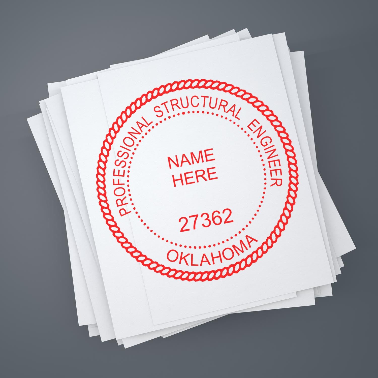 Stack of papers with a red Oklahoma Professional Structural Engineer stamp. Blog post: Empowering Engineers: Unveiling Oklahoma PE Stamp Guidelines.