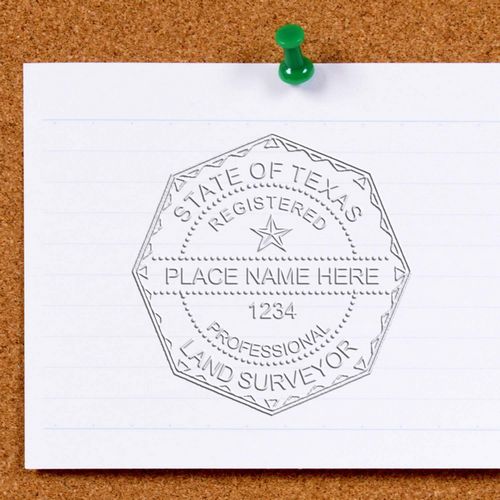 Image of a Texas Land Surveyor Seal embossed on a white paper pinned to a corkboard. Blog post: Texas Land Surveyor Seal.