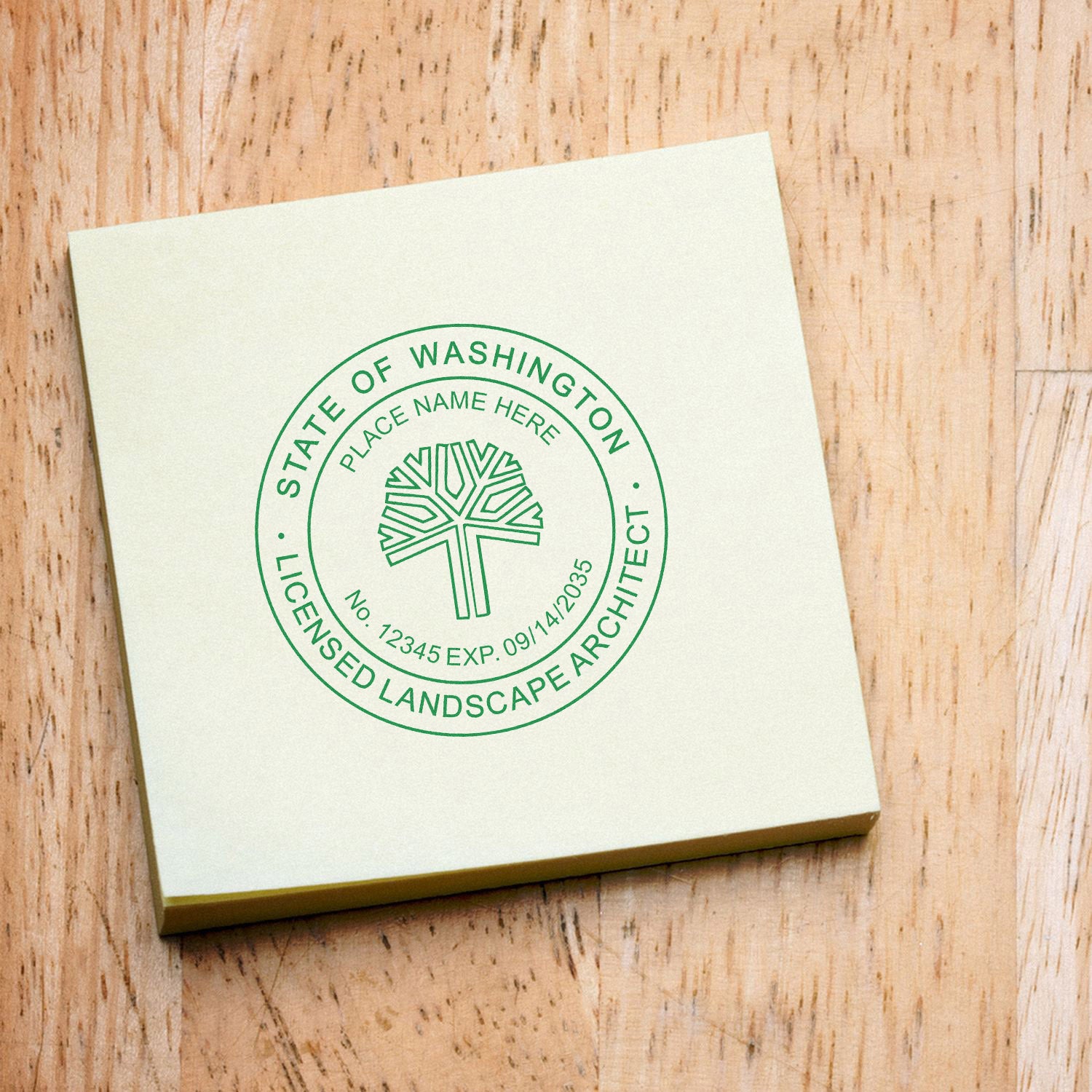 Washington Landscape Architect Feature Image: A green stamp on a yellow notepad displaying the State of Washington Licensed Landscape Architect seal.