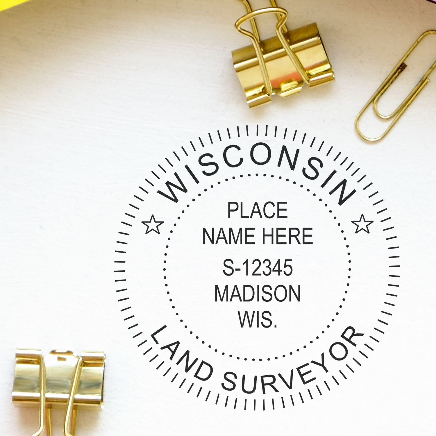 Image of a Wisconsin Land Surveyor seal with gold binder clips and paperclips. Blog post: Power Up Your Practice with a Wisconsin Land Surveyor Seal Feature Image.