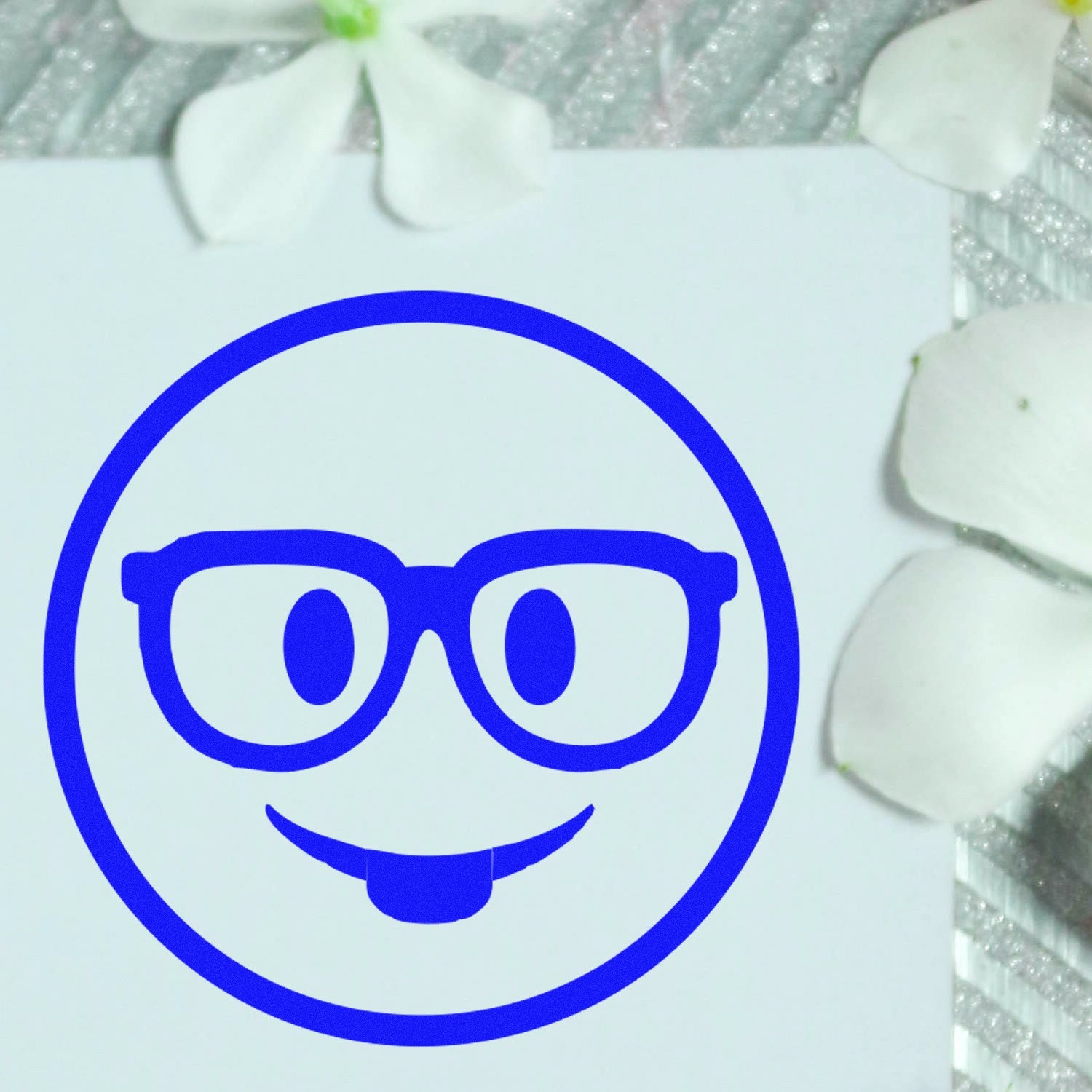 Wood Handle Smarty McGlasses Emotes Rubber Stamp featuring a blue smiley face with glasses, perfect for adding a playful touch to crafts and stationery.