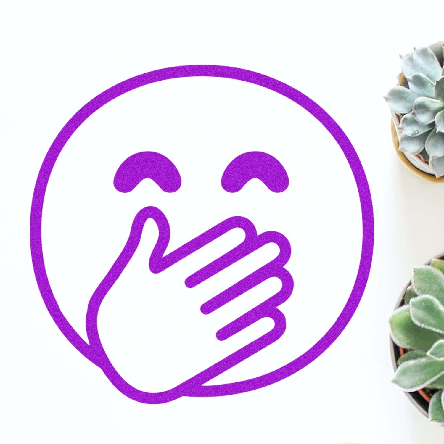 Self-Inking Giggling Gus Emoji Stamp with a purple laughing face and hand covering mouth, surrounded by small green succulents on a white background. Perfect for adding fun to any project.