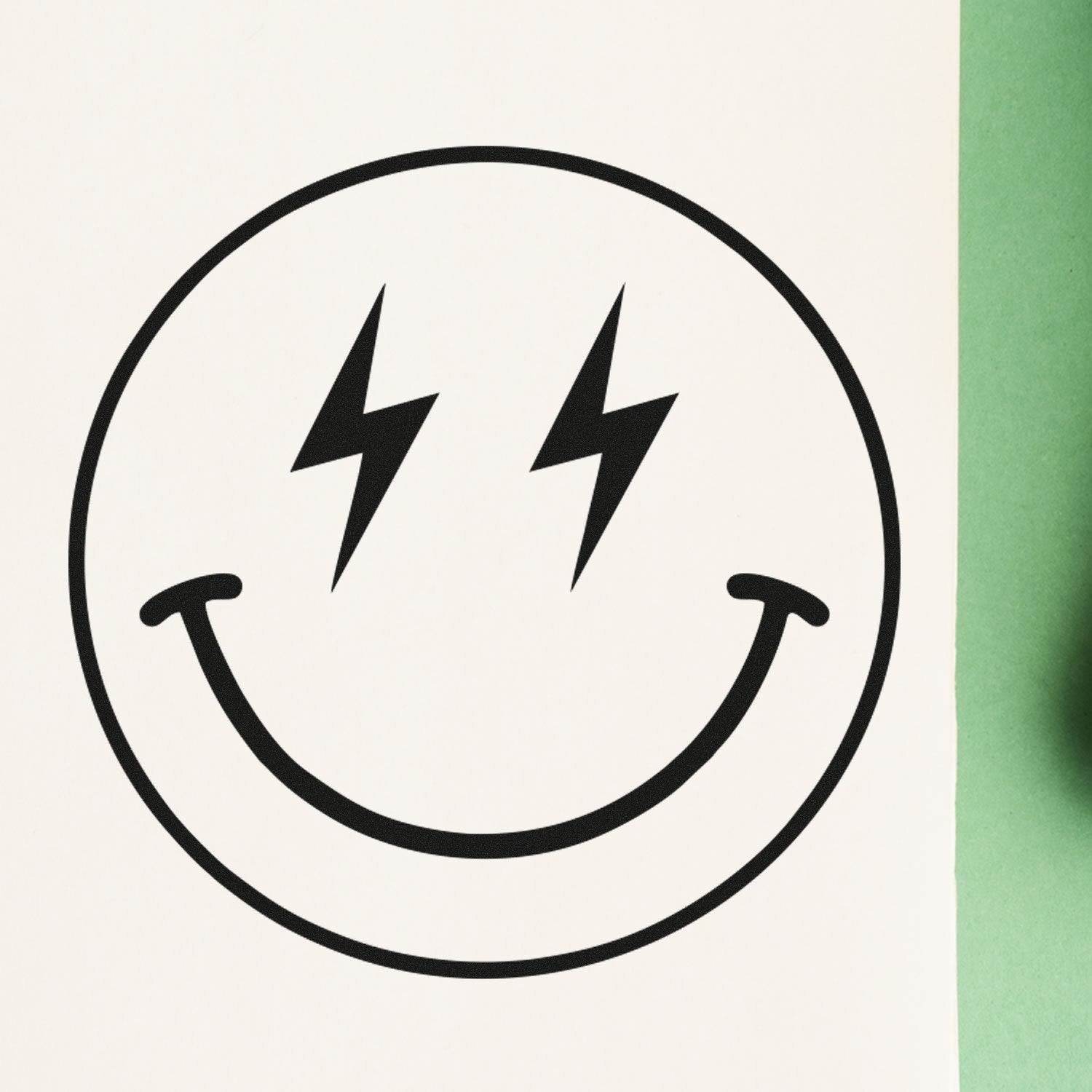 Self-Inking Electric Joy Emoji Stamp featuring a smiling face with lightning bolt eyes on a white background, perfect for adding fun and energy to your projects.