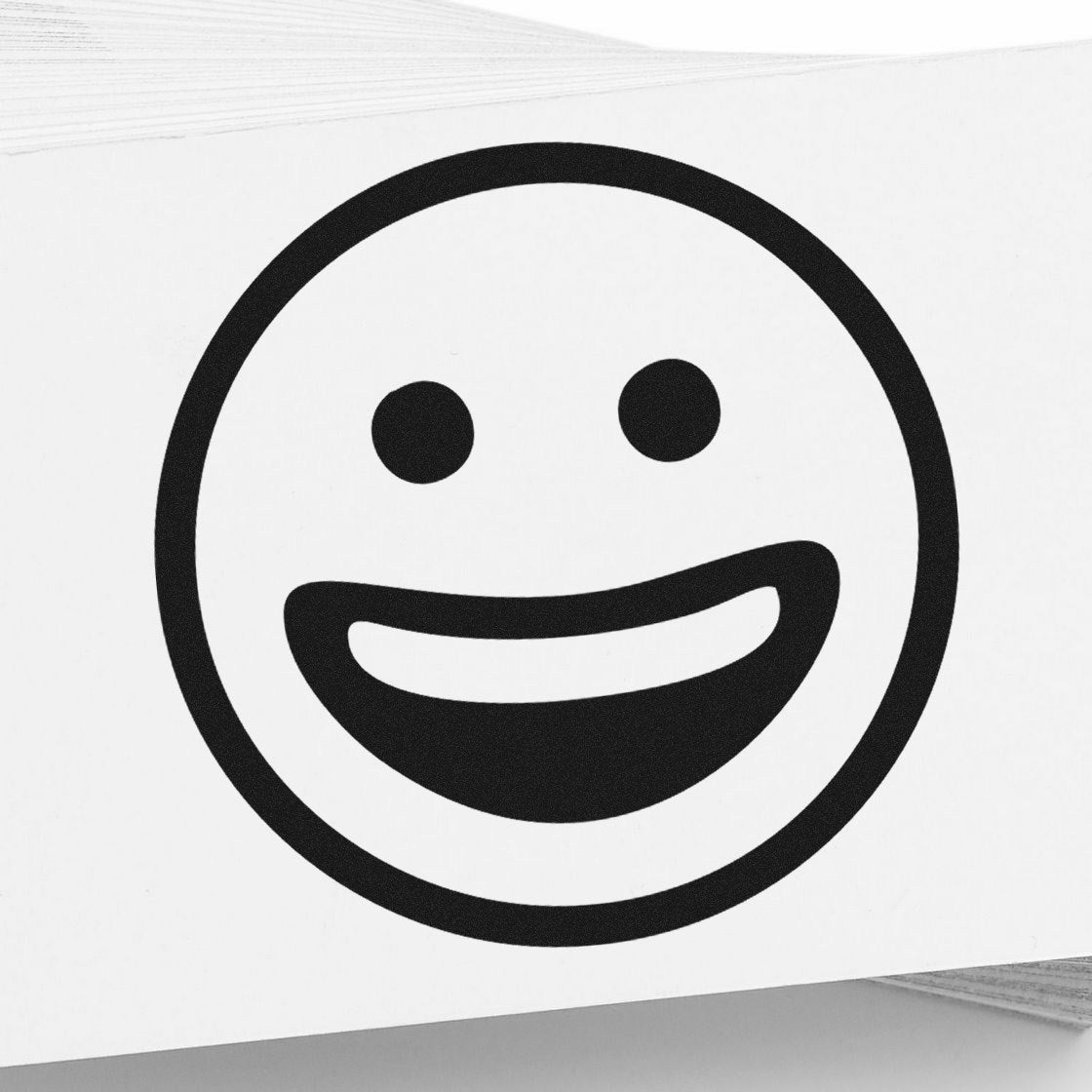 Self-Inking Classic Grin Emoji Stamp with a bold black smiley face design on a white background, perfect for adding a cheerful touch to any project.