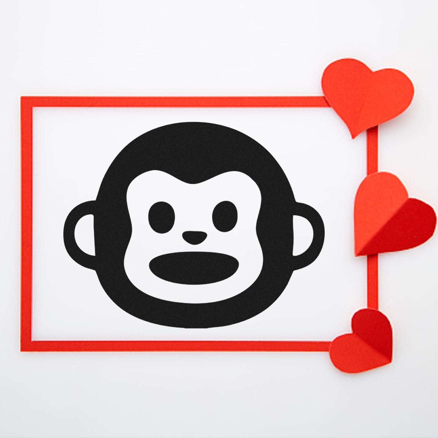 Image of Self-Inking Monkey Marvel Reaction Stamp featuring a cute monkey face design, framed with red hearts, ideal for adding fun to documents and crafts.