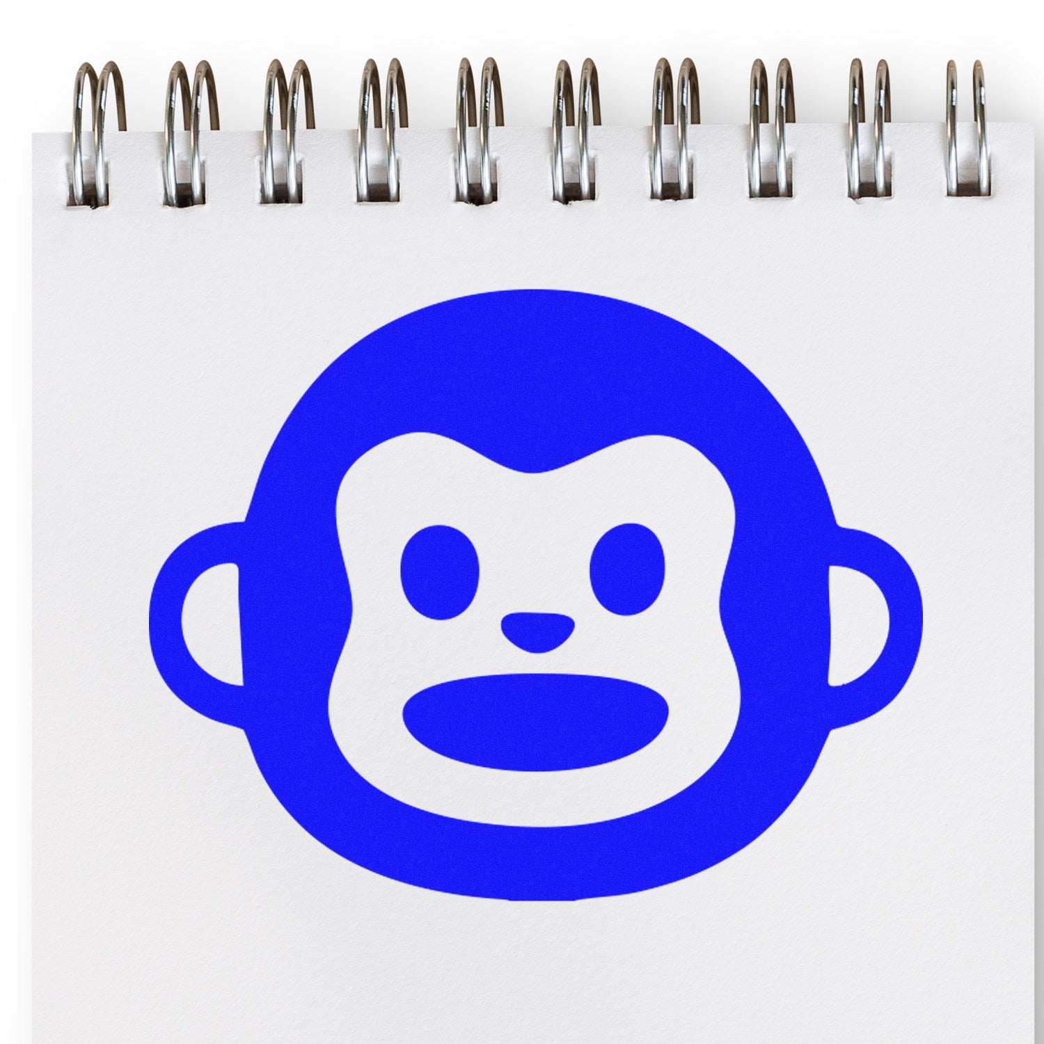 Self-Inking Monkey Marvel Reaction Stamp featuring a blue monkey face design on a white notepad, perfect for adding fun and expressive stamps to your documents.