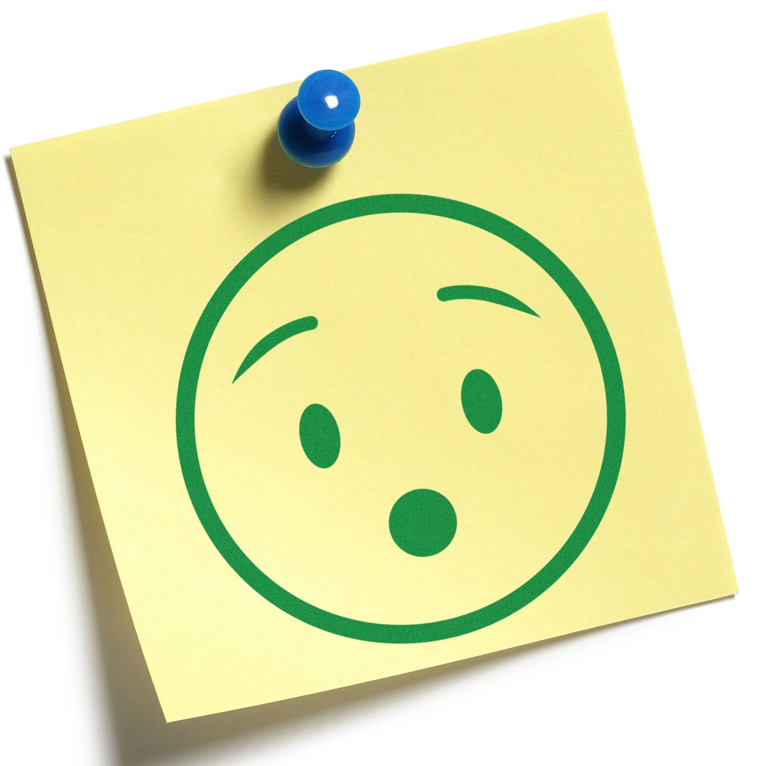 Self-Inking Surprised Stanley Smiley Stamp on yellow sticky note with green surprised face, pinned with a blue pushpin. Perfect for adding fun expressions to your documents and crafts.