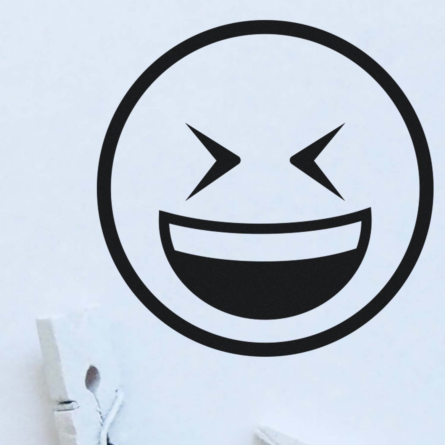 Self-Inking Excited Squint Emoji Stamp on white paper, showcasing a bold, black, smiling face with squinting eyes. Perfect for adding fun and personality to your projects.