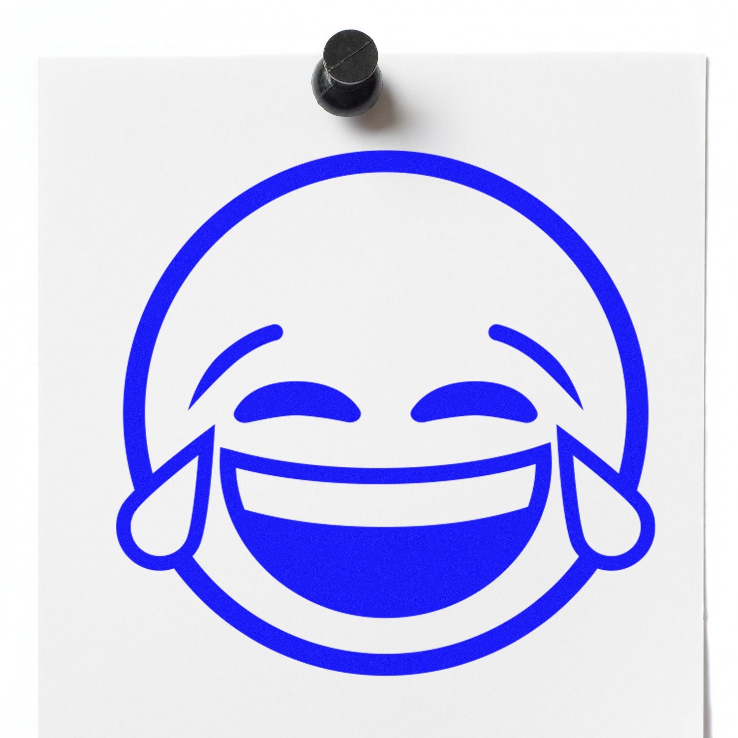 Self-Inking Tearful Giggles Emoji Stamp in use, featuring a blue laughing face with tears design on white paper. Perfect for adding fun and emotion to your projects.