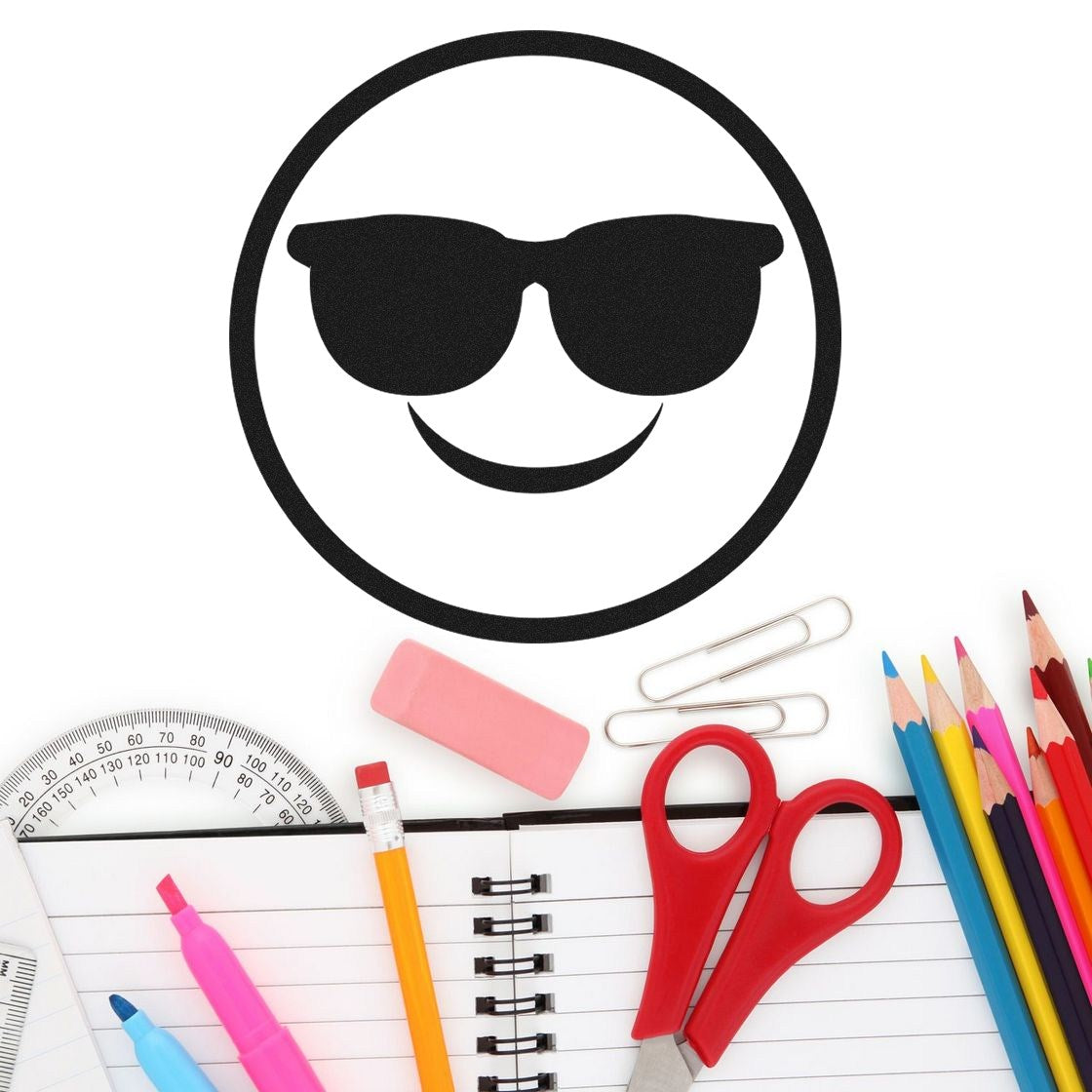 Self-Inking Cool Shades Pictogram Stamp on a desk with stationery, featuring a smiling face with sunglasses design. Perfect for adding fun to your projects.