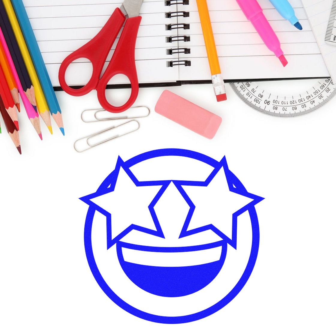 Wood Handle Starry Eyed Emotes Rubber Stamp with a blue starry-eyed smiley face design, surrounded by colorful stationery items like pencils, scissors, and a notebook. Perfect for creative projects.