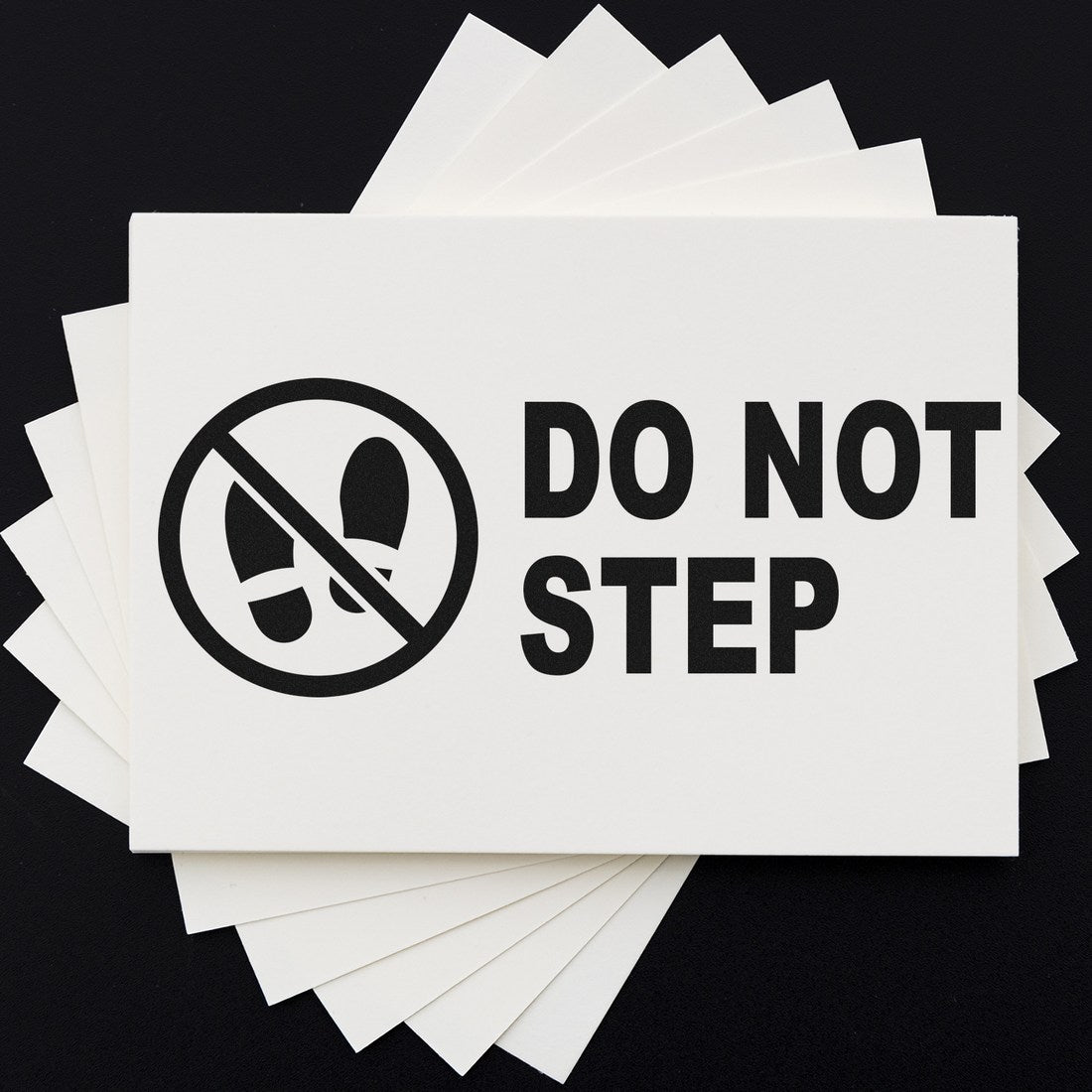 Image of the Slim Pre-Inked Caution Do Not Step Stamp, featuring a bold Do Not Step message with a crossed-out shoe icon, ideal for clear safety warnings.