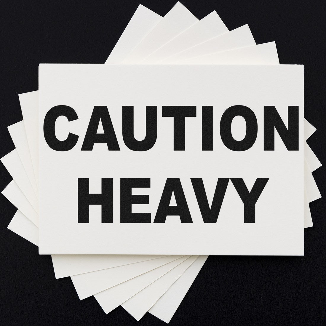 Maxlight Premium Heavy Caution Stamp with bold black text on a white background, emphasizing 'Caution Heavy' for clear visibility and safety.