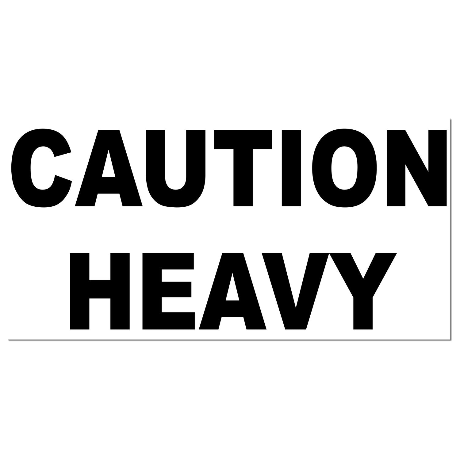 Image of a Slim Pre-Inked Heavy Caution Stamp with bold black text CAUTION HEAVY on a white background, designed for clear, durable marking.