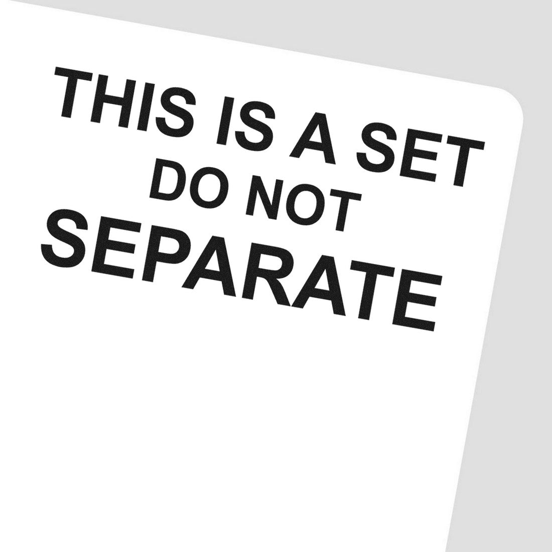 Image of a Self-Inking Do Not Separate Set Stamp with bold black text on a white background, ideal for organizing and labeling items efficiently.