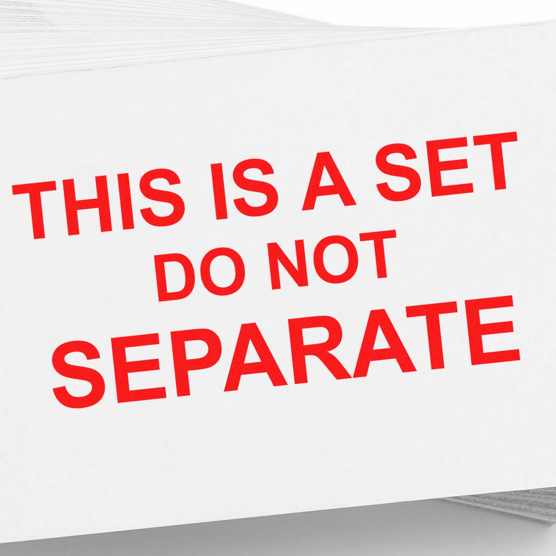 Slim Pre-Inked Do Not Separate Set Stamp in use, featuring bold red text on a white background, ideal for packaging and shipping needs.