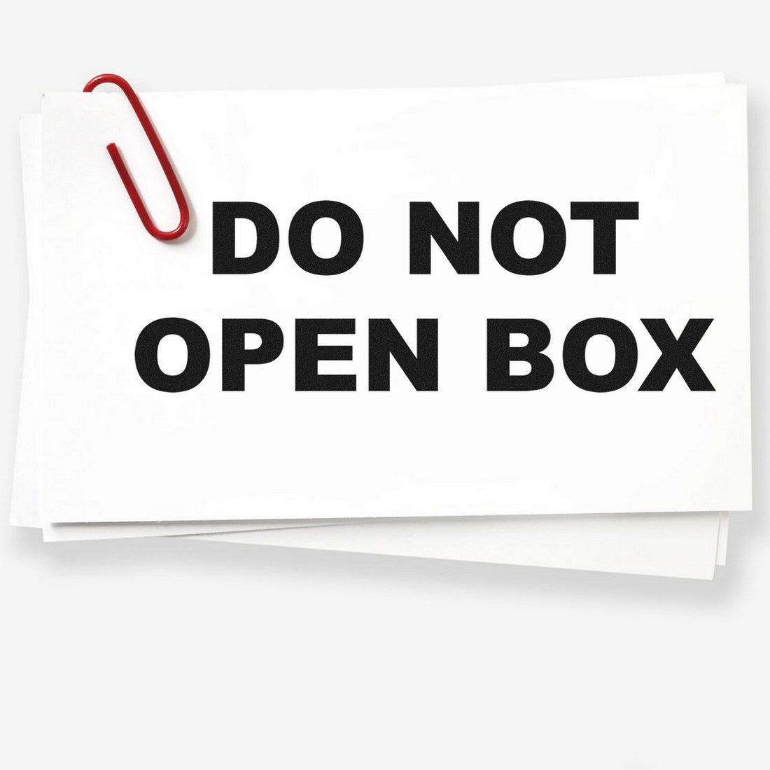 Wood Handle Do Not Open Box Rubber Stamp with bold black text on white paper, secured by a red paperclip. Ideal for packaging and shipping warnings.