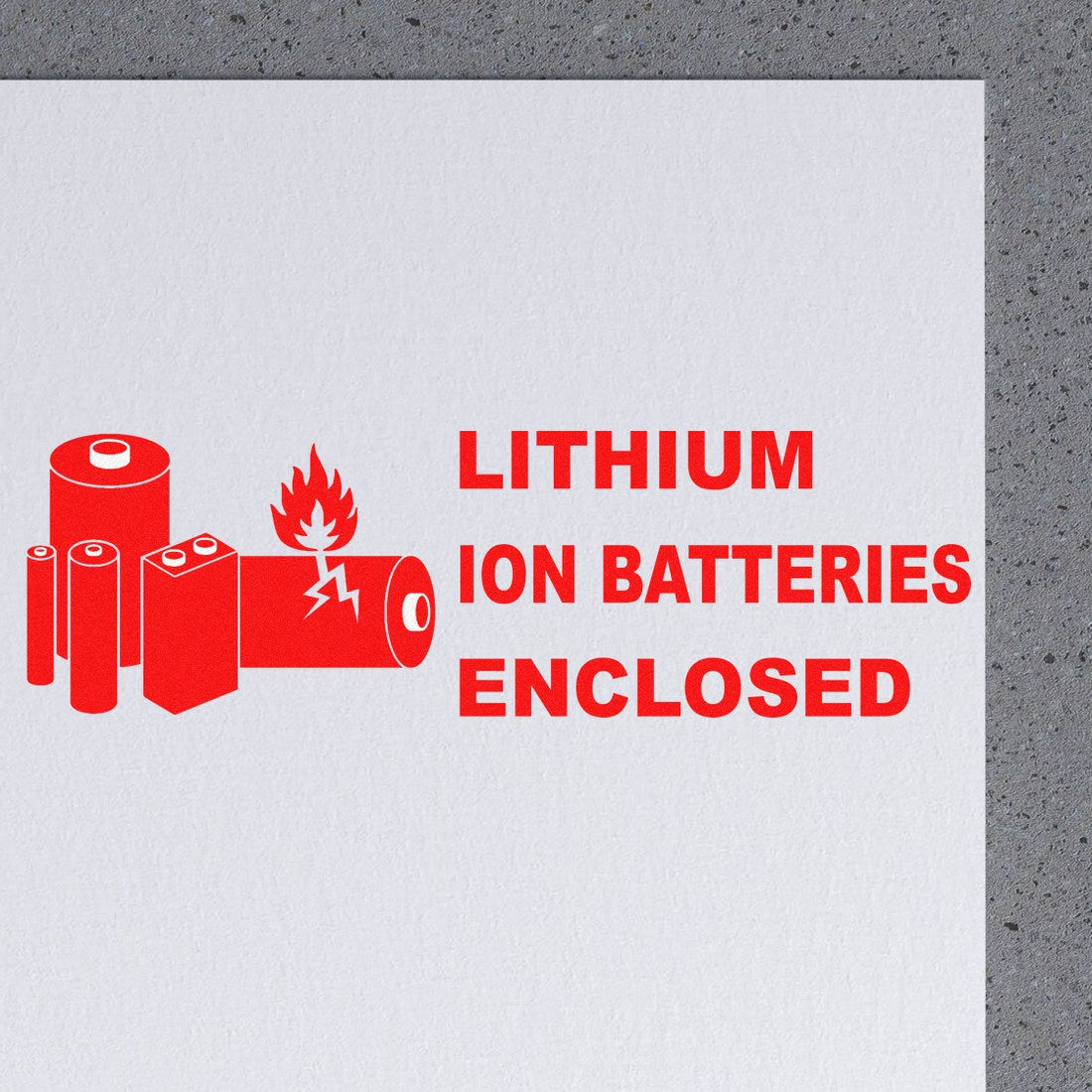 Wood Handle Lithium Ion Battery Warning Rubber Stamp with red battery icons and Lithium Ion Batteries Enclosed text on white paper, highlighting safety warnings.