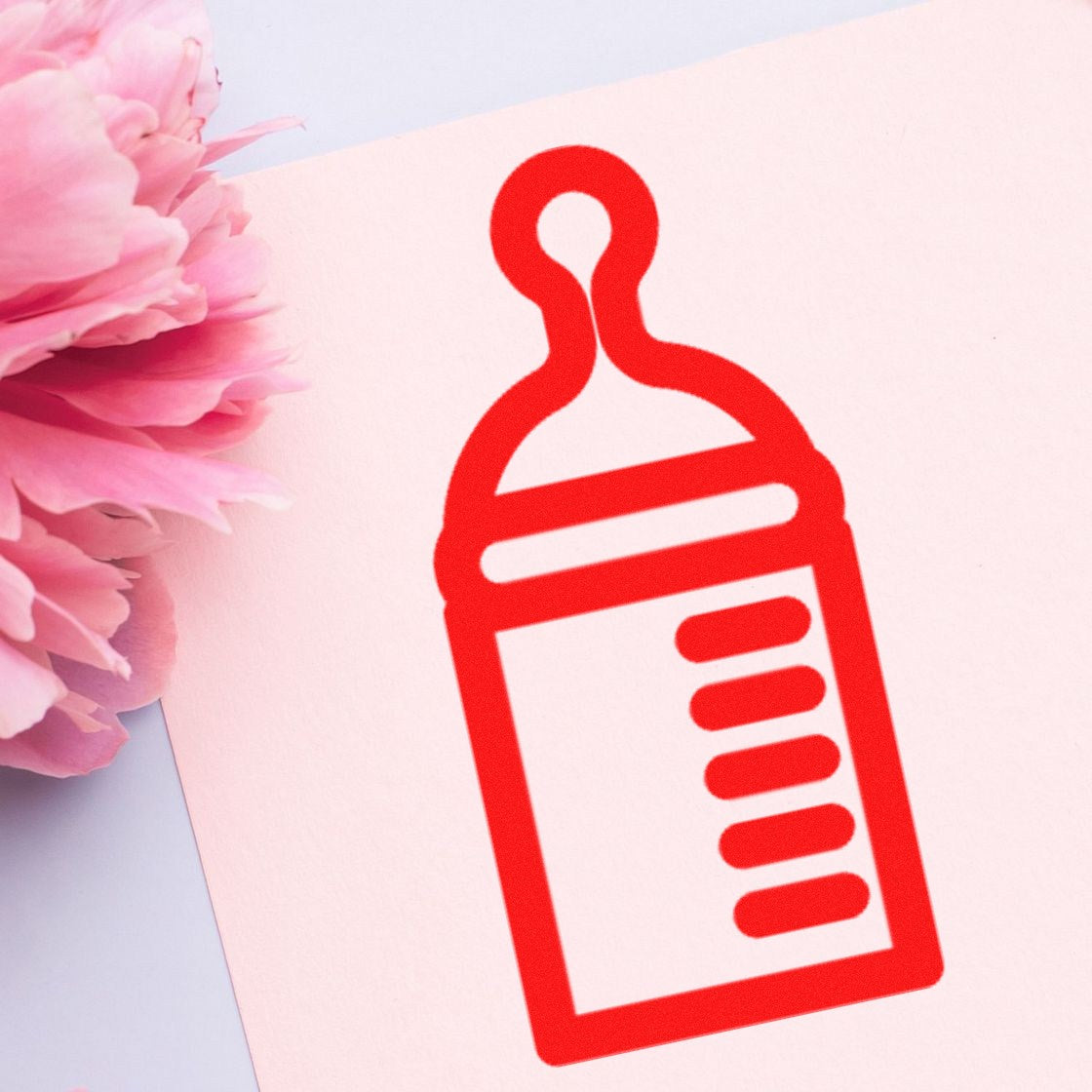 Image of the Self-Inking Bundle of Joy Frequent Buyer Stamp, featuring a red baby bottle design on a pink background, perfect for frequent buyers.