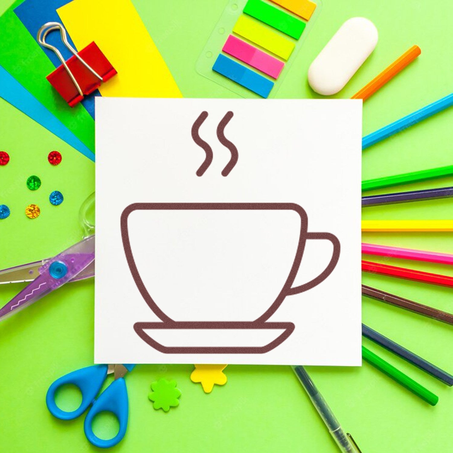 Self-Inking Steaming Coffee Cup Loyalty Stamp on a colorful desk with stationery items, showcasing its design and functionality. Perfect for cafes and loyalty programs.