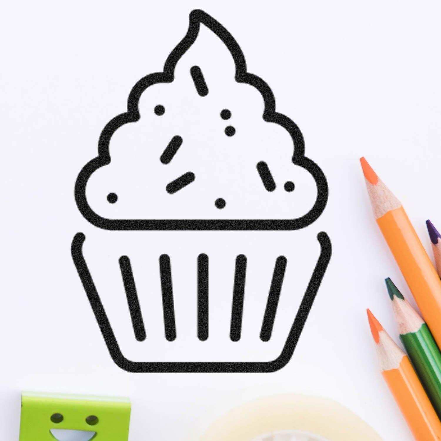 Wood Handle Happy Cupcakes Card Reward Rubber Stamp featuring a cupcake design with sprinkles, surrounded by colorful pencils and a smiling eraser on a white background.