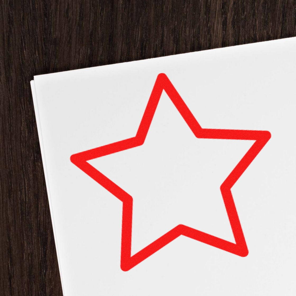 Wood Handle Star Loyalty Points Rubber Stamp with a red star imprint on white paper, showcasing its design and functionality. Perfect for rewarding customer loyalty.