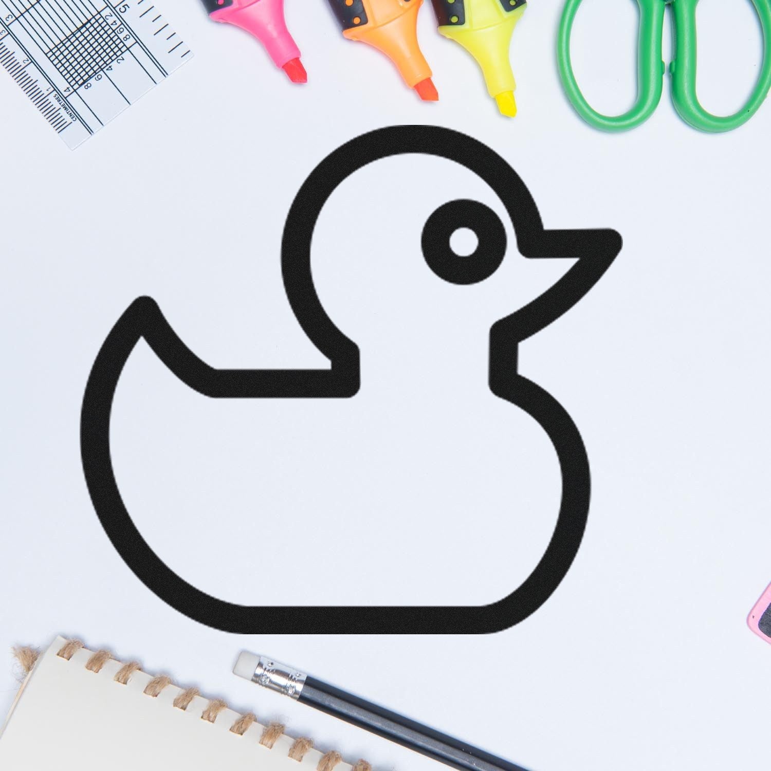 Image of the Self-Inking Ducky Delight Repeat Customer Stamp, featuring a cute duck design, surrounded by colorful office supplies on a white background. Perfect for business use.