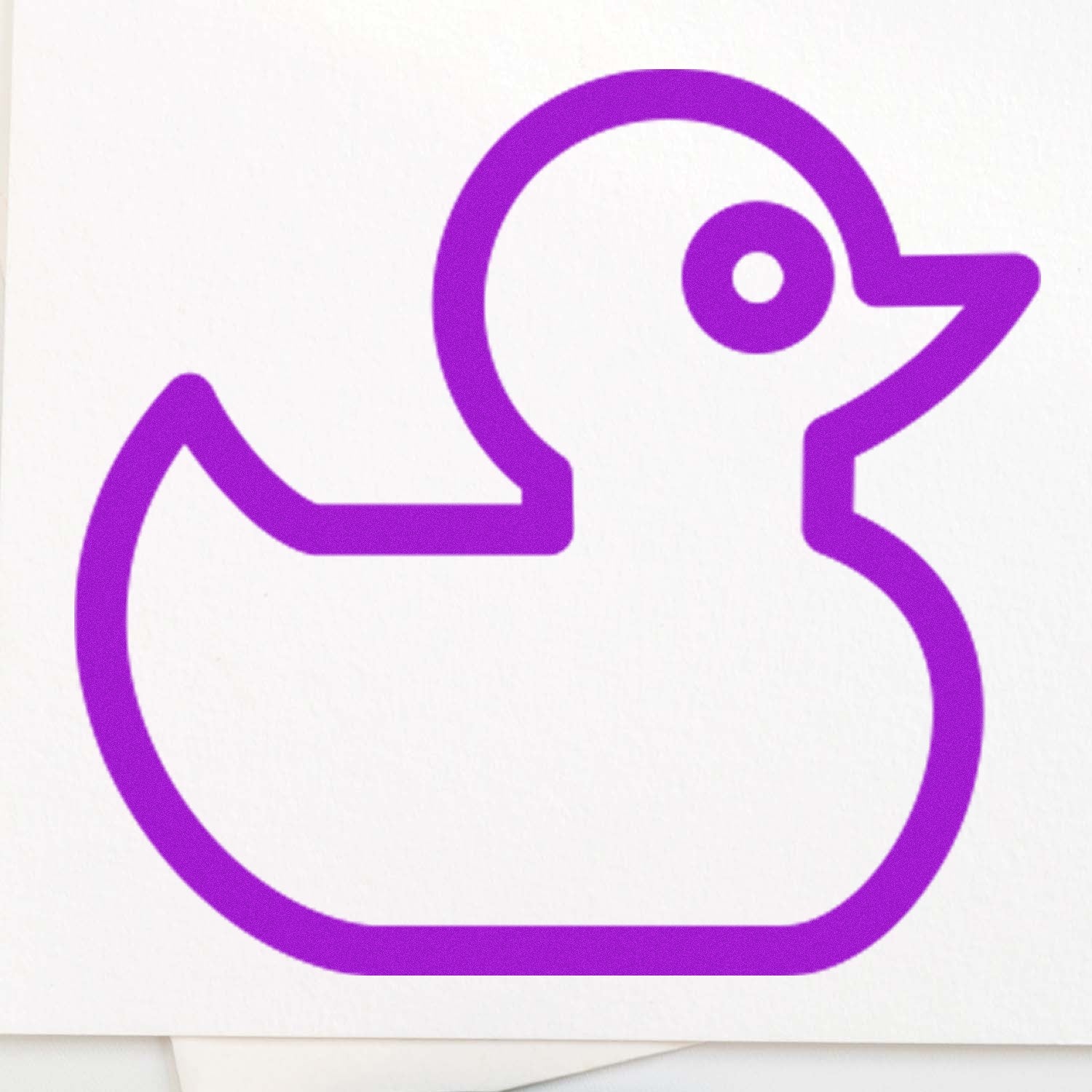 Wood Handle Ducky Delight Repeat Customer Rubber Stamp featuring a purple outline of a duck on white paper. Perfect for crafting and personalizing stationery.