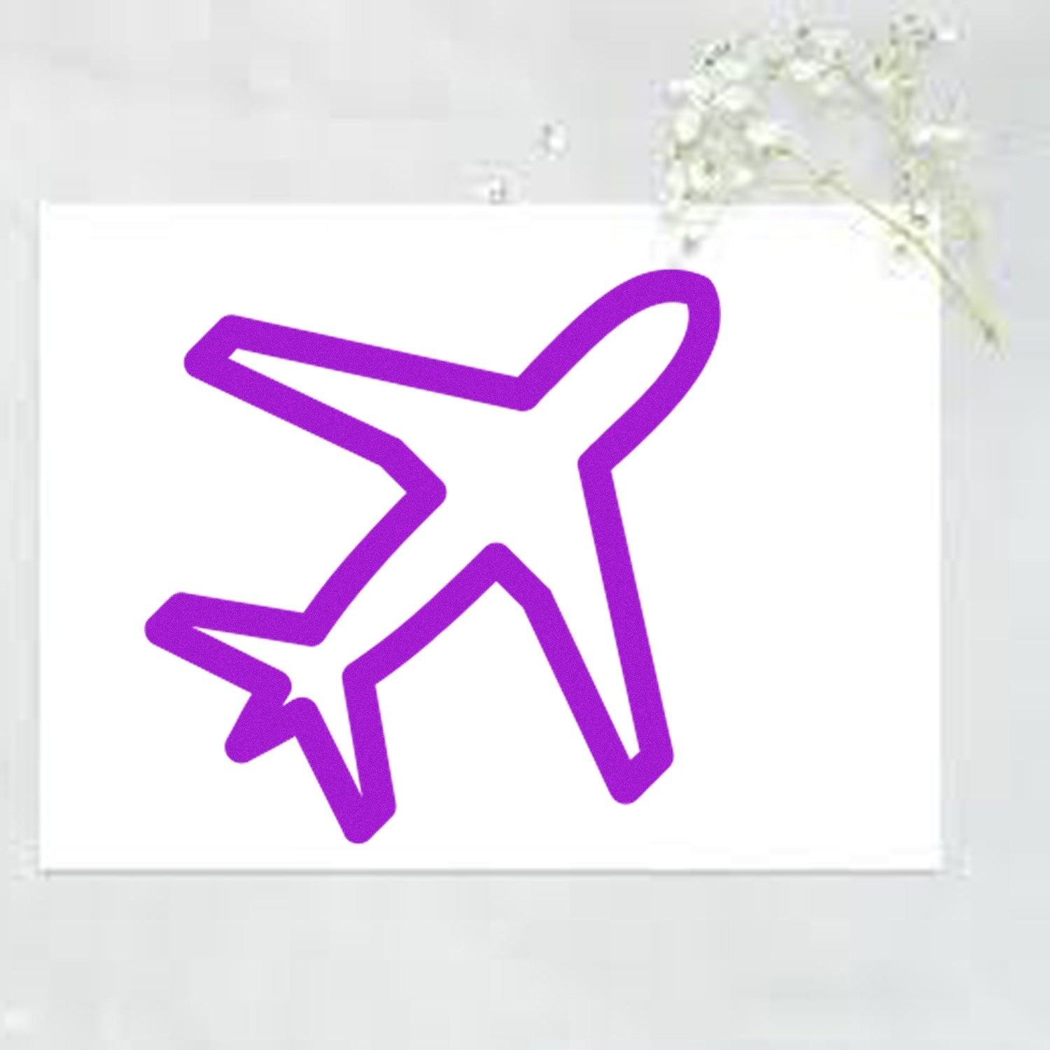 Self-Inking Jetsetter-Based Rewards Stamp featuring a purple airplane design on a white background, ideal for travel-themed rewards and incentives.