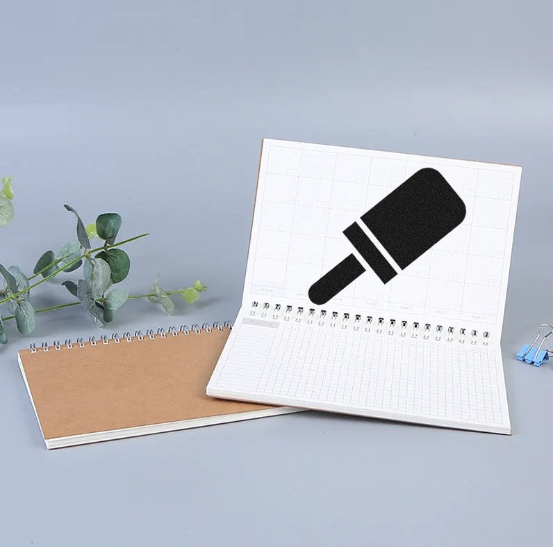 Wood Handle Pop Of Approval Visit Rubber Stamp on open notebook, showcasing its unique design. Ideal for adding a creative touch to documents and crafts.