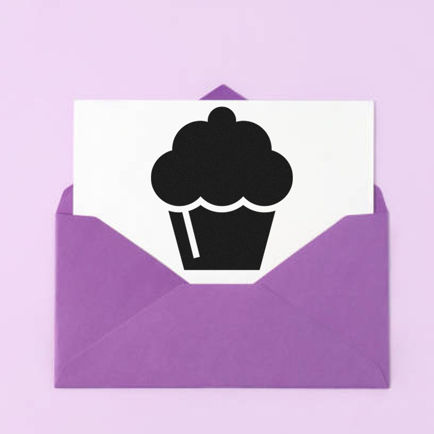 Image of the Self-Inking Cupcake Delight Loyalty Stamp featuring a cupcake design on a white card, placed inside a purple envelope, against a light purple background.