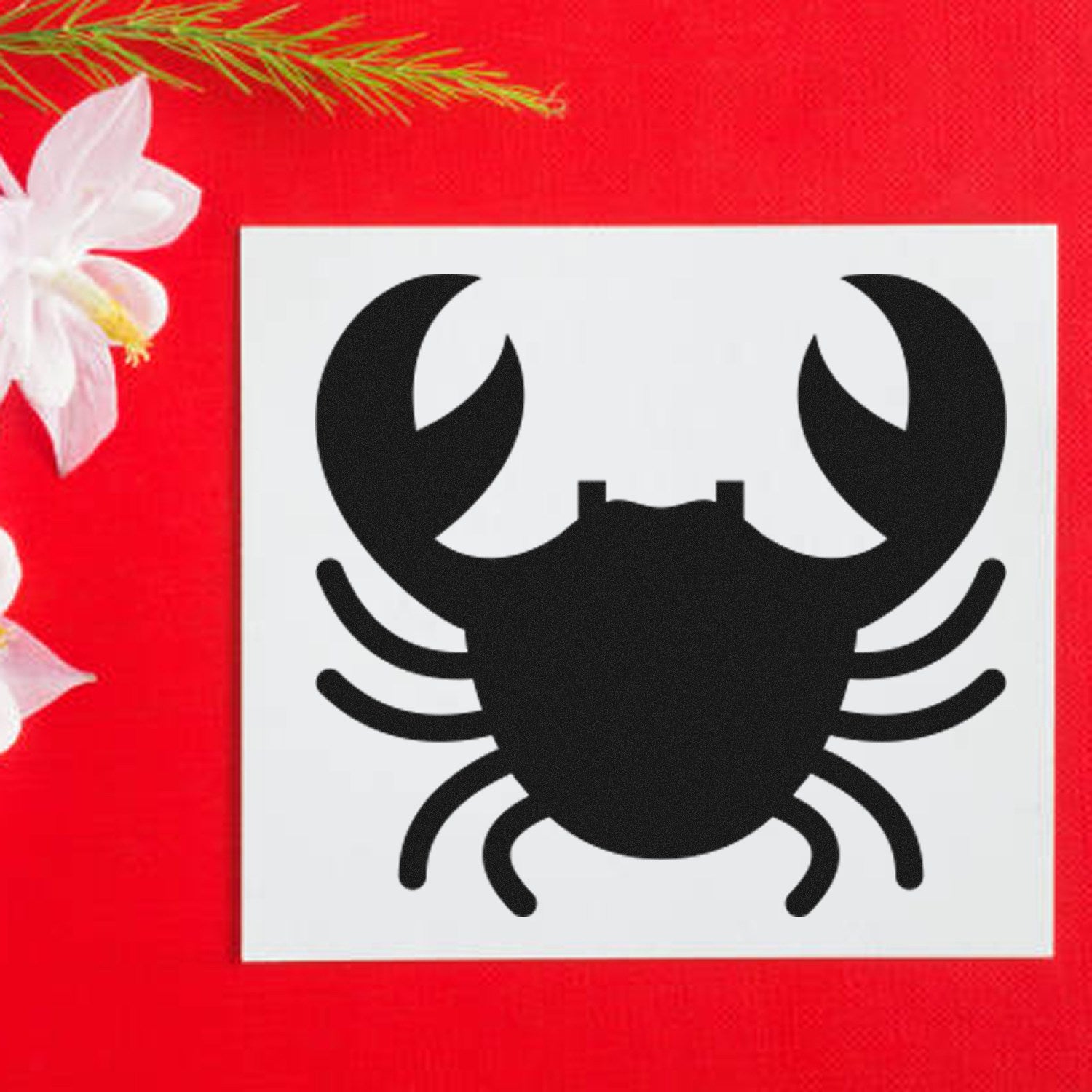 Self-Inking Crabby Rewards Stamp featuring a black crab design on a white square, set against a vibrant red background with white flowers. Perfect for teachers and parents.